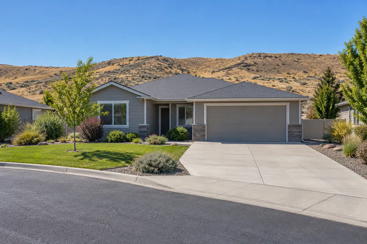 A ranch house with an empty driveway